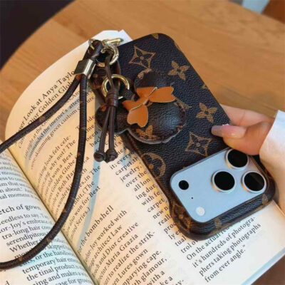 2026-05-11_085812_514 Luxury Monogram Case with Bow Charm & Wrist Lanyard for iPhone 12-18 Pro & Pro Max