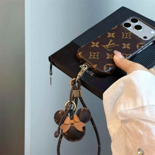 2026-05-11_085850_650 Luxury Monogram Case with Bow Charm & Wrist Lanyard for iPhone 12-18 Pro & Pro Max