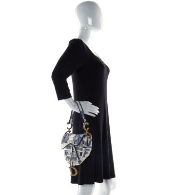 5006a770535f7cf90e6d271b568d927b CHRISTIAN DIOR Canvas Embroidered Around the World Saddle Bag Blue