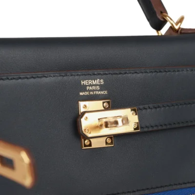 ad45b507f3c71af36091f984d0c86621 Hermès Colormatic Kelly Retourne 25 Caban, Black and Chai Swift Gold Hardware