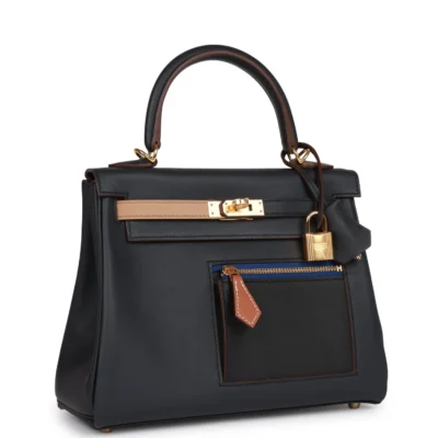 bafe2ef0ec2d49c60d9b6f7dba6a36c2 Hermès Colormatic Kelly Retourne 25 Caban, Black and Chai Swift Gold Hardware