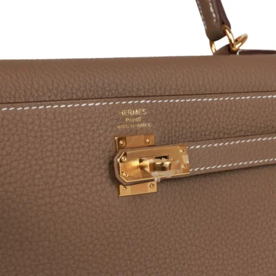 ce1e78048cd32249af4f84d014b32fcd Hermès Kelly Retourne 25 Etoupe Togo Gold Hardware