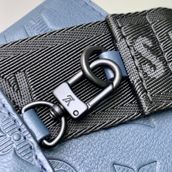 POCHETTE VOYAGE 22 IN DARK BLUE MONOGRAM SHADOW CALFSKIN
