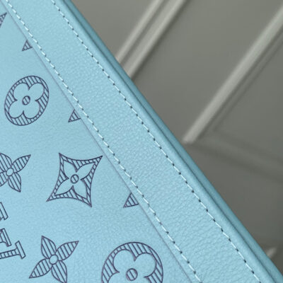 POCHETTE VOYAGE 26 IN SKY BLUE MONOGRAM ECLIPSE CALFSKIN