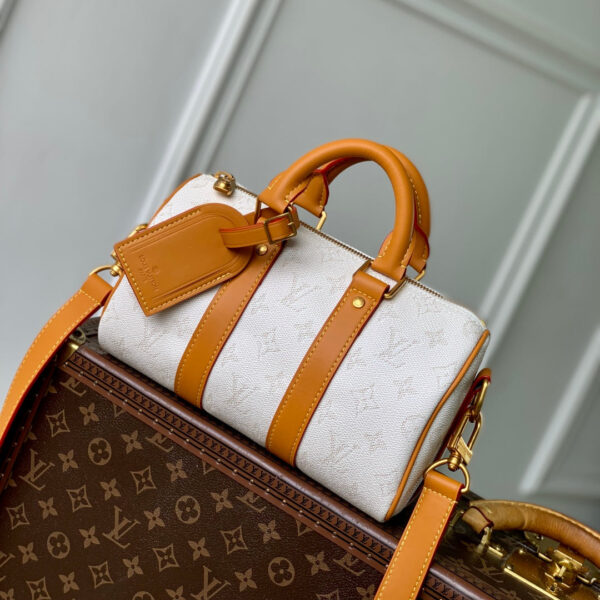 imgHD_4828b284_20250509_cmp_i1746781315680_6210_0_0_jpg KEEPALL BANDOULIÈRE 25 IN WHITE MONOGRAM HERITAGE CANVAS BRWON CALFSKIN