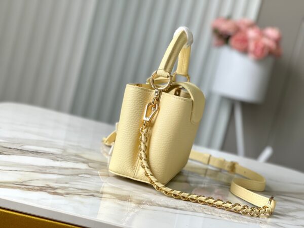 img_460b6f34_20241002_a1727828726801_8217_jpg CAPUCINES EAST-WEST MINI 22 IN BANANA YELLOW TAURILLON GOLD HARDWARE