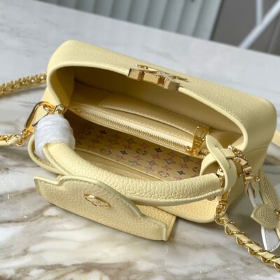 img_460b6f34_20241002_a1727828726834_8775_jpg CAPUCINES EAST-WEST MINI 22 IN BANANA YELLOW TAURILLON GOLD HARDWARE