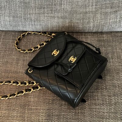 CHANEL 26S BACKPACK WITH FRONT POCKET 21 IN BLACK QUILTED LAMBSKIN GOLD HARDWARE