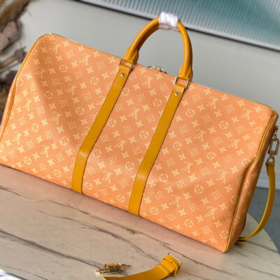 KEEPALL BANDOULIÈRE 55 IN ORANGE MONOGRAM HERITAGE CANVAS