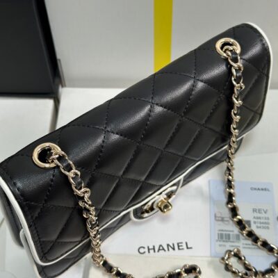 QUILTED FLAP BAG WITH WHITE TRIM 19 IN BLACK LAMBSKIN