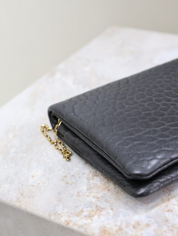 CALYPSO POUCH 24 IN BLACK ELEPHANT TEXTURED LAMBSKIN GOLD LOGO