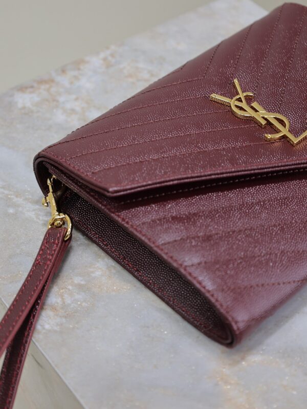 CASSANDRE CLUTCH 21 IN BORDEAUX RED LAMBSKIN GOLD HARDWARE