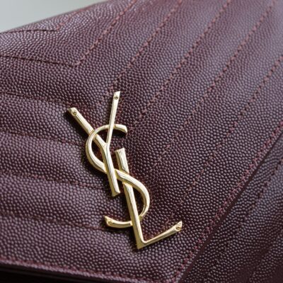 CASSANDRE CLUTCH 21 IN BORDEAUX RED LAMBSKIN GOLD HARDWARE